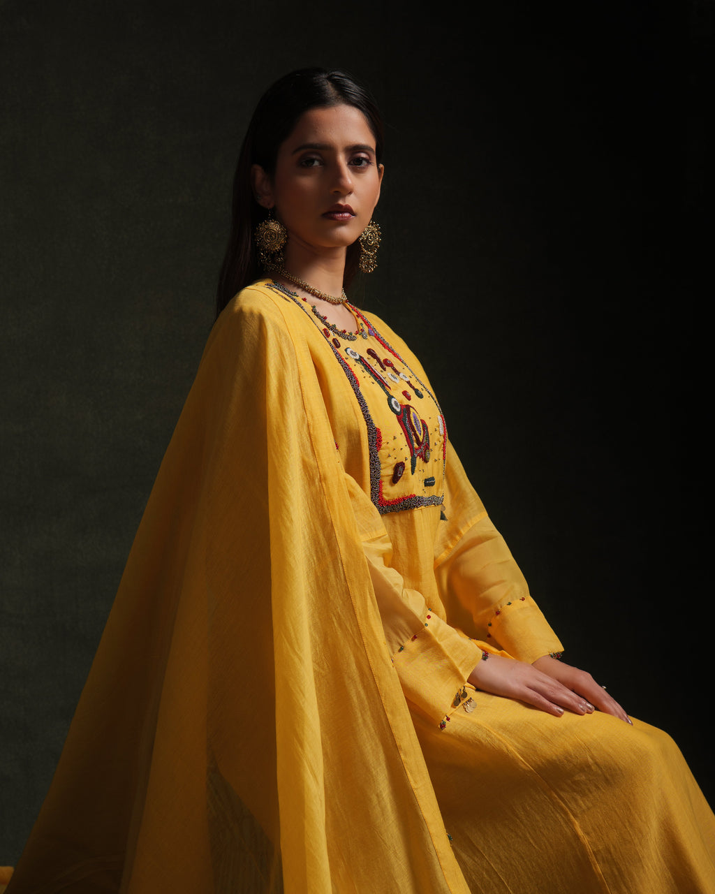 Yellow mul chanderi kurta set with embroidery, organza panels and dupatta by Asaaye