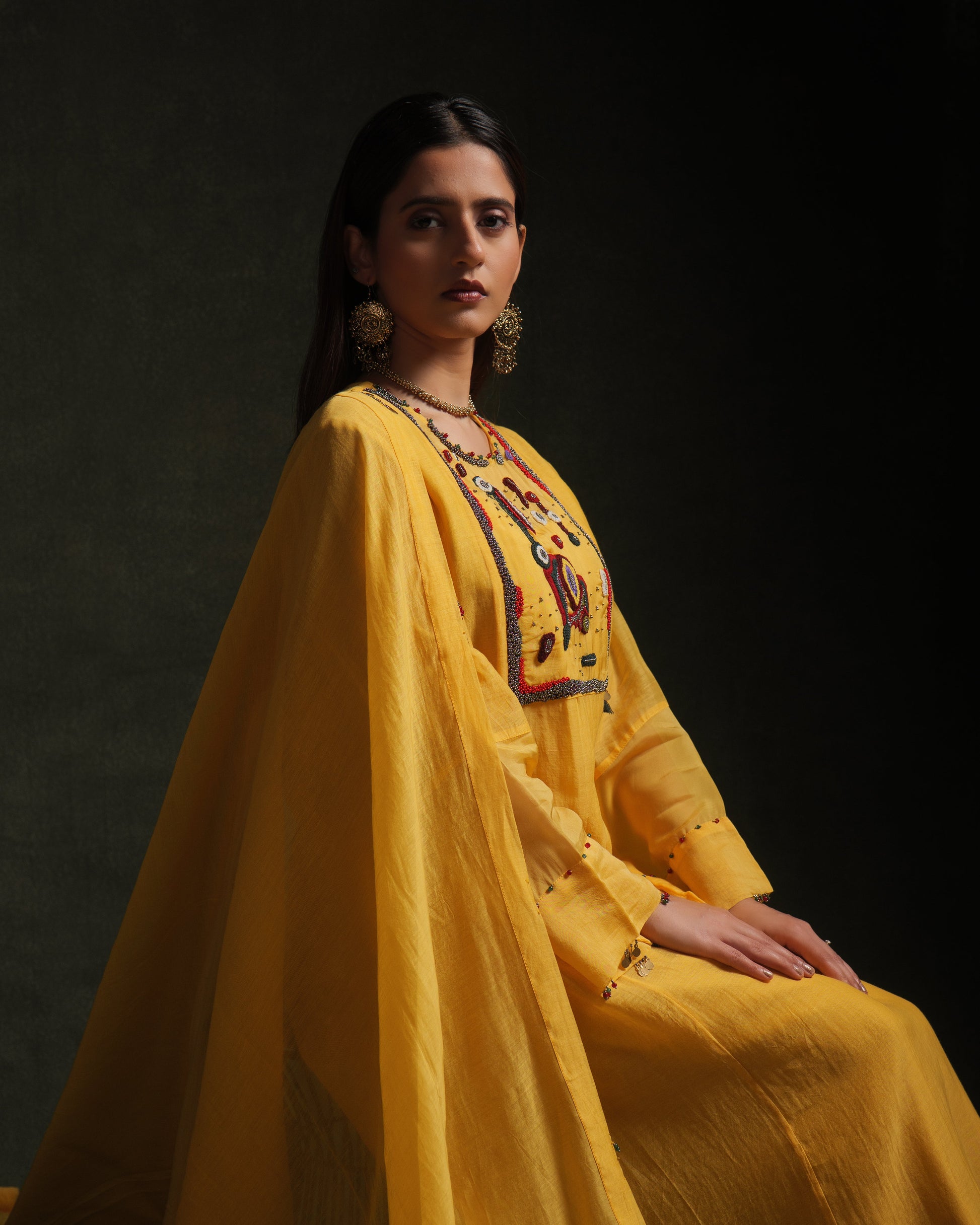 Yellow mul chanderi kurta set with embroidery, organza panels and dupatta by Asaaye