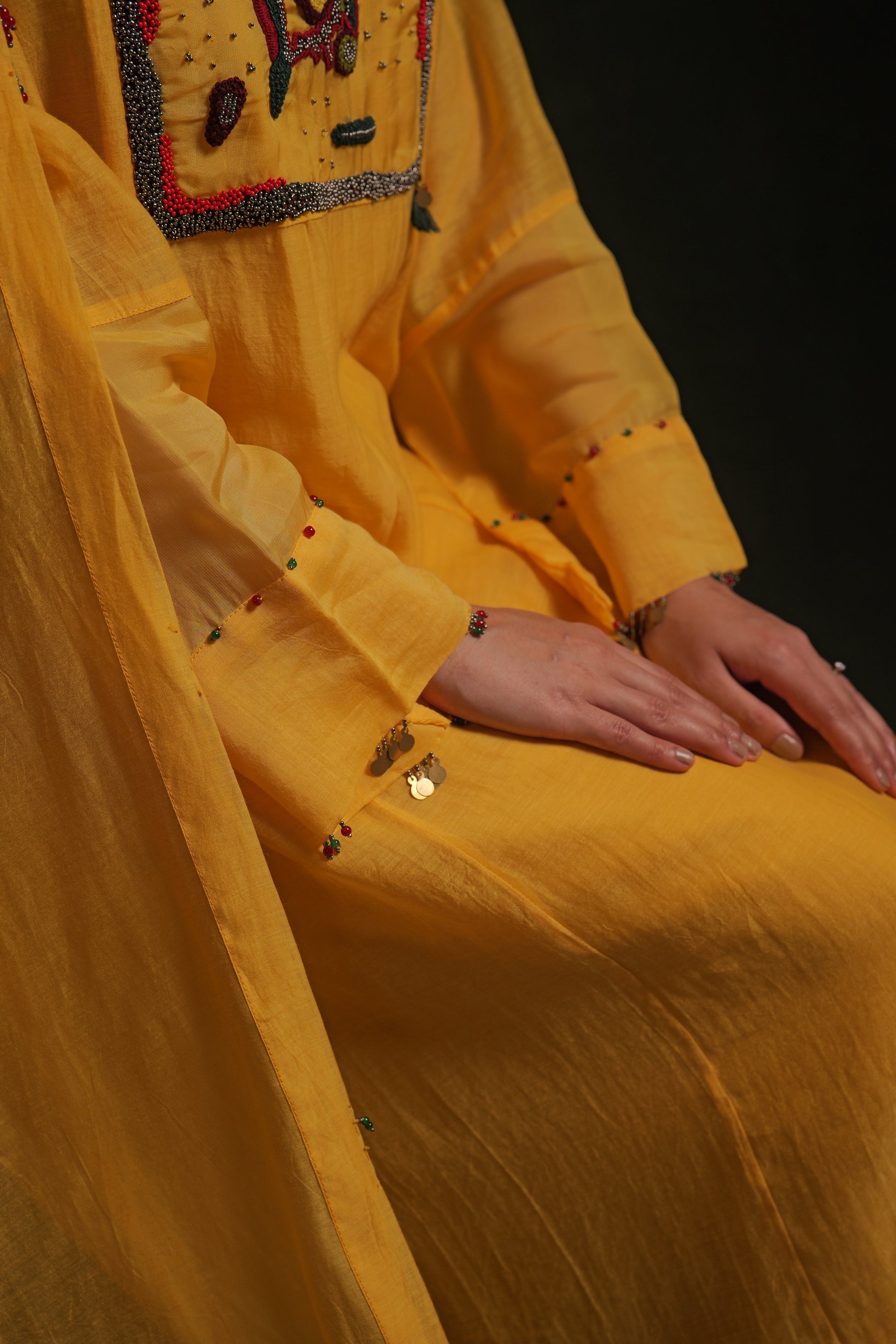 Yellow mul chanderi kurta set with embroidery, organza panels and dupatta by Asaaye