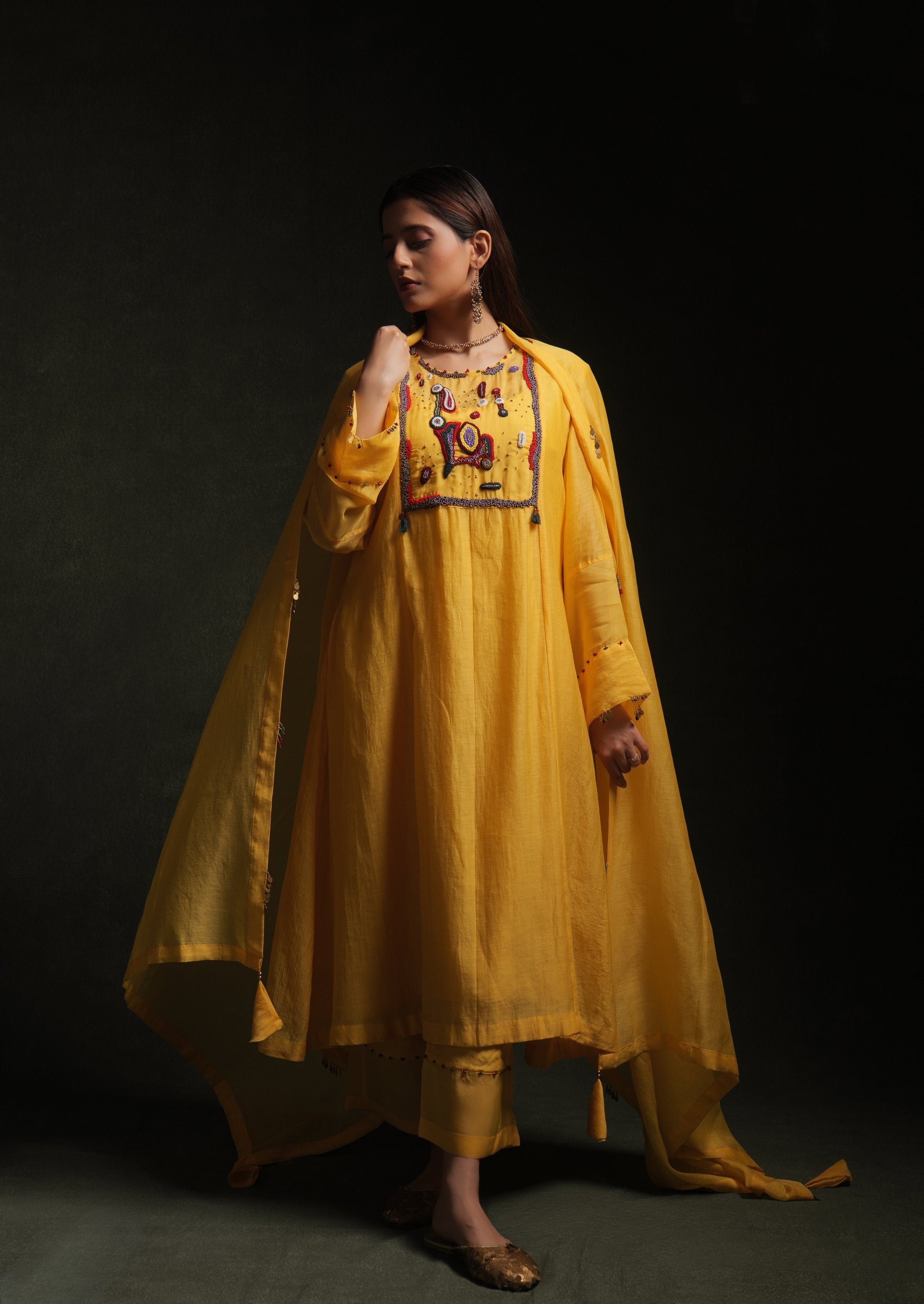 Yellow mul chanderi kurta set with embroidery, organza panels and dupatta by Asaaye