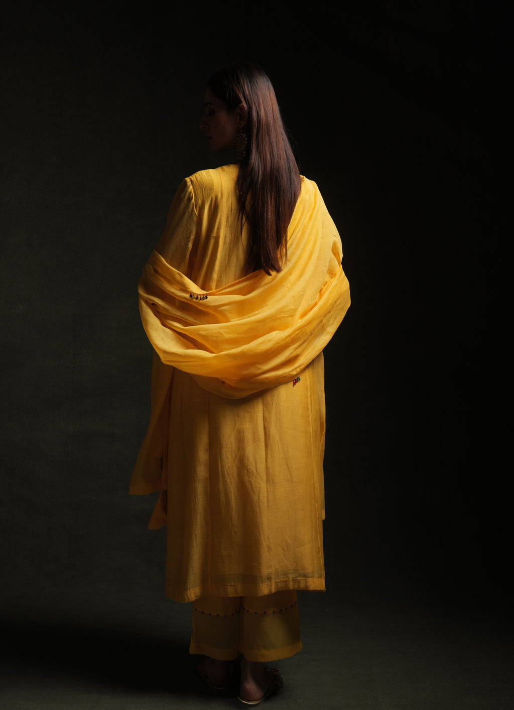 Yellow mul chanderi kurta set with embroidery, organza panels and dupatta by Asaaye