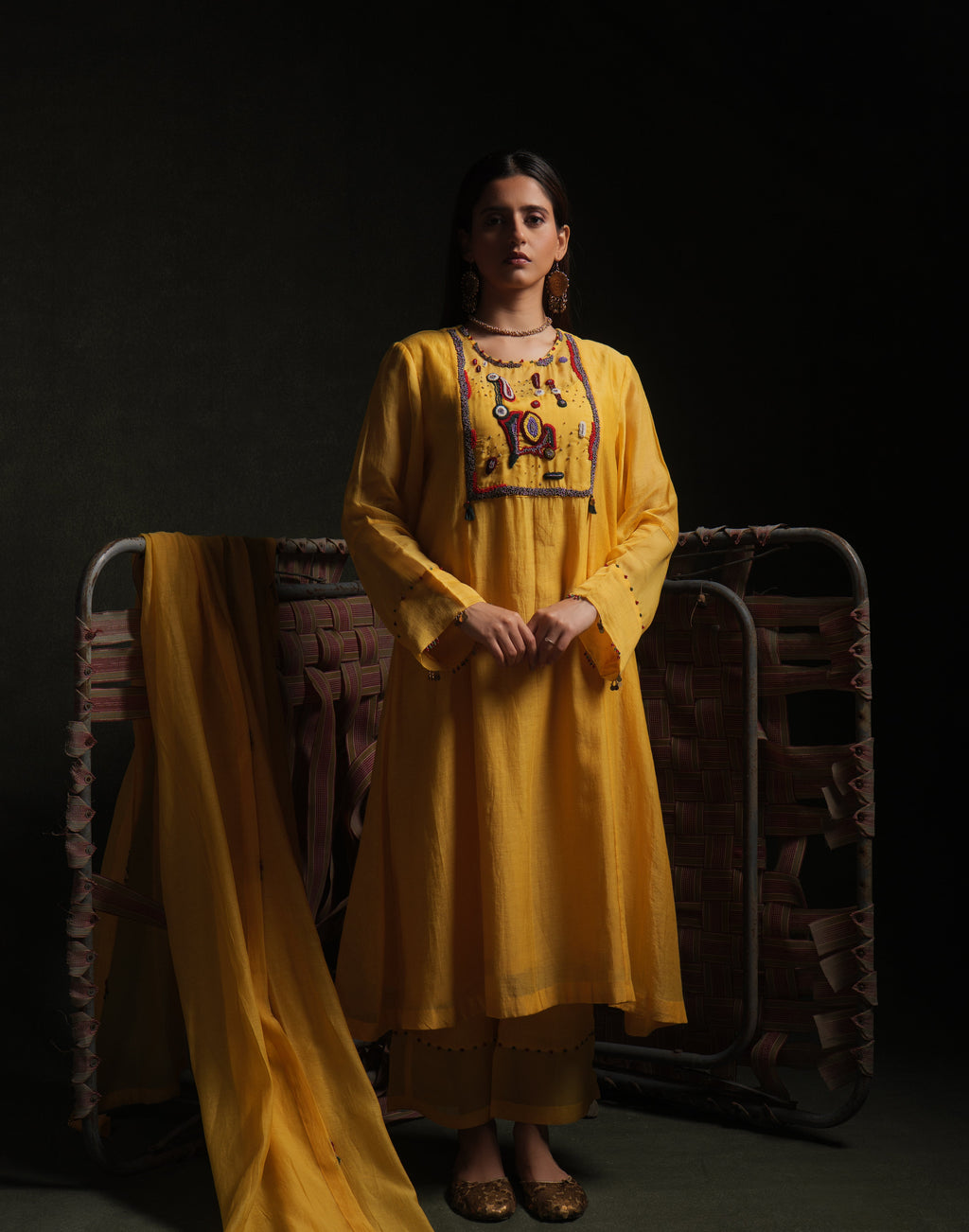 Yellow mul chanderi kurta set with embroidery, organza panels and dupatta by Asaaye