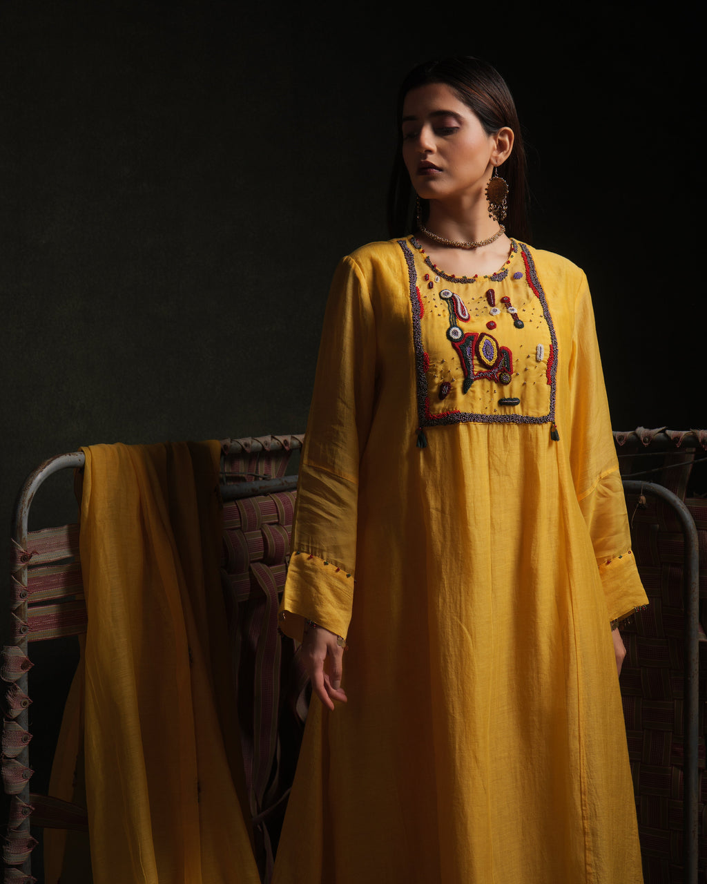 Yellow mul chanderi kurta set with embroidery, organza panels and dupatta by Asaaye