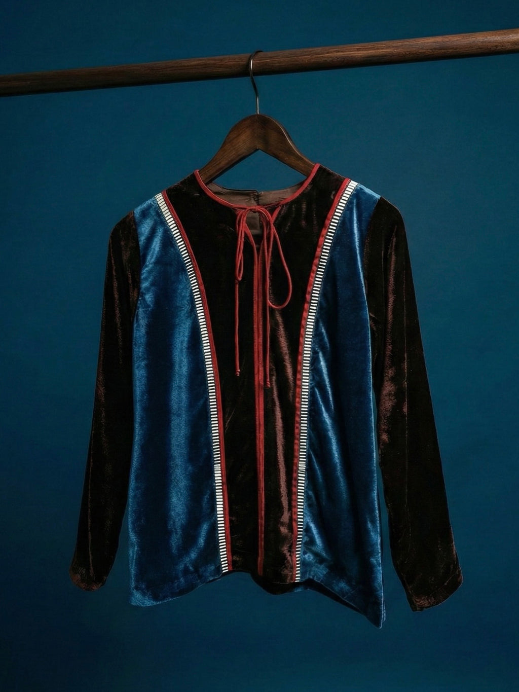 Teal and brown colorblock velvet top with red piping and 3D silver detailing by Asaaye