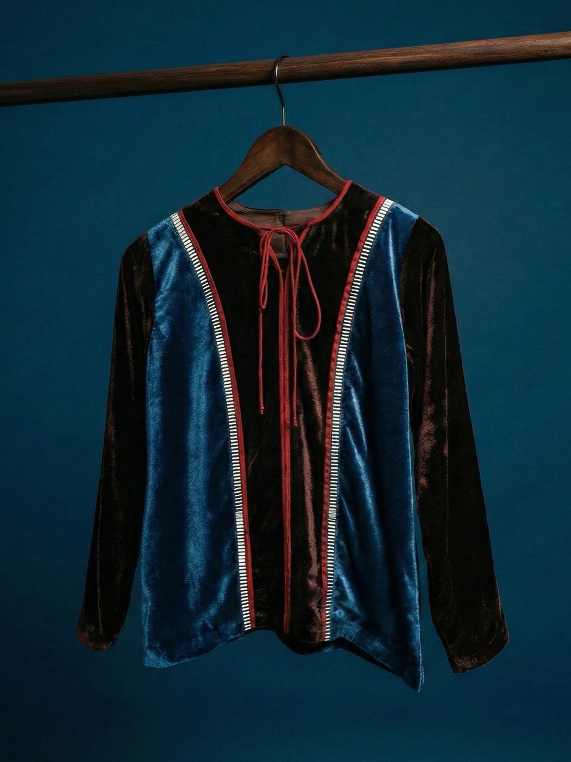 Teal and brown colorblock velvet top with red piping and 3D silver detailing by Asaaye