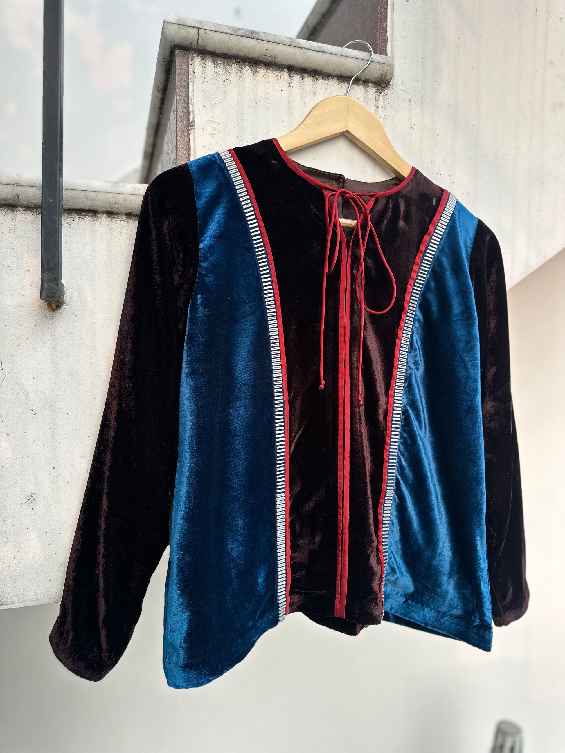 Teal and brown colorblock velvet top with red piping and 3D silver detailing by Asaaye