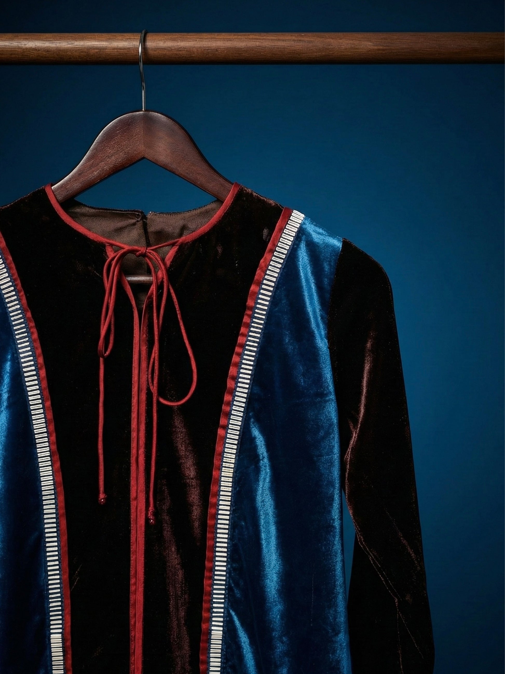 Teal and brown colorblock velvet top with red piping and 3D silver detailing by Asaaye