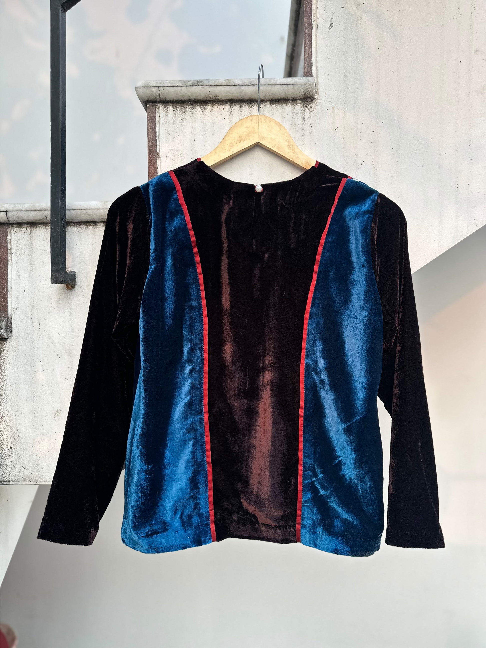 Teal and brown colorblock velvet top with red piping and 3D silver detailing by Asaaye