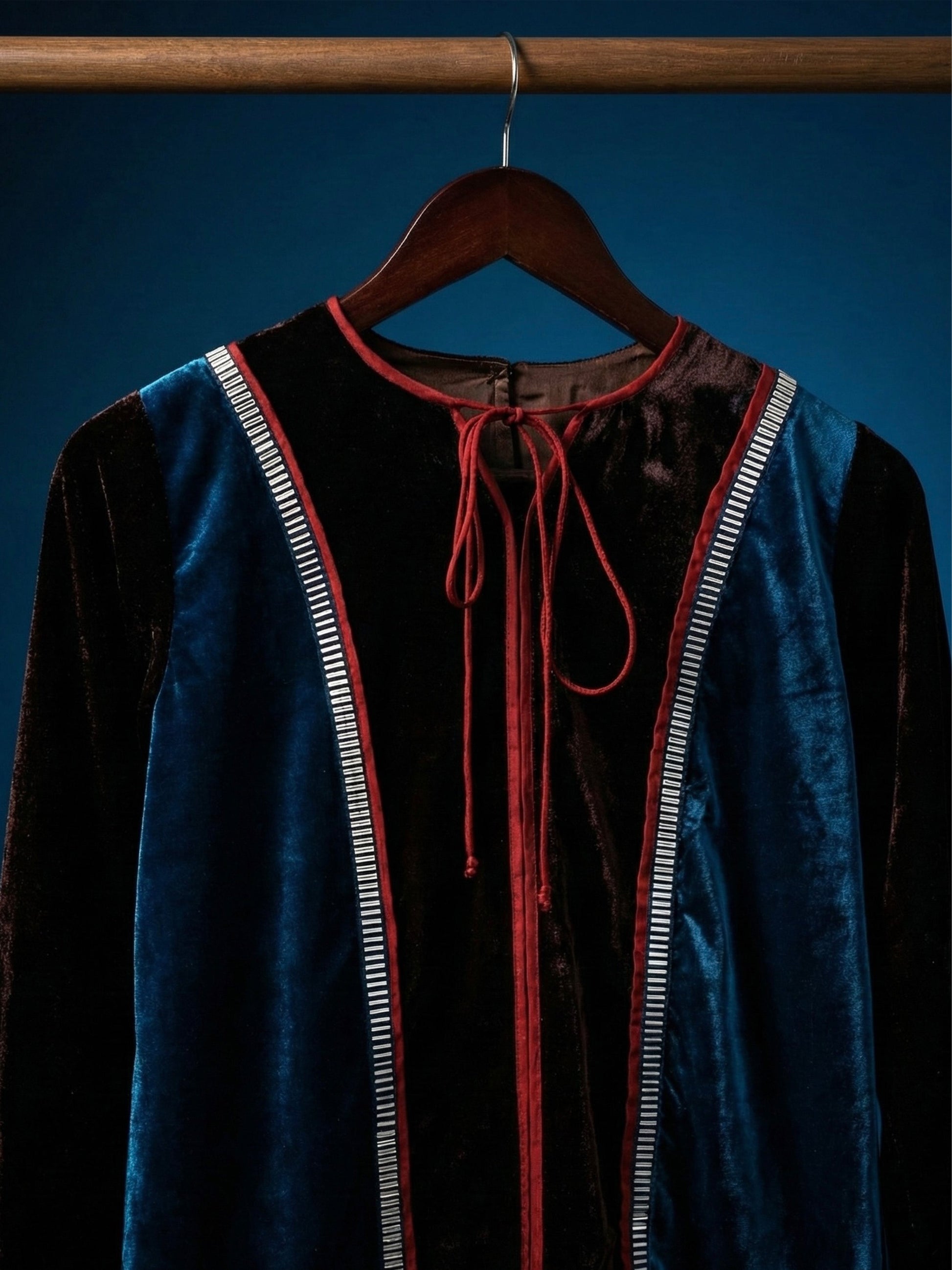 Teal and brown colorblock velvet top with red piping and 3D silver detailing by Asaaye