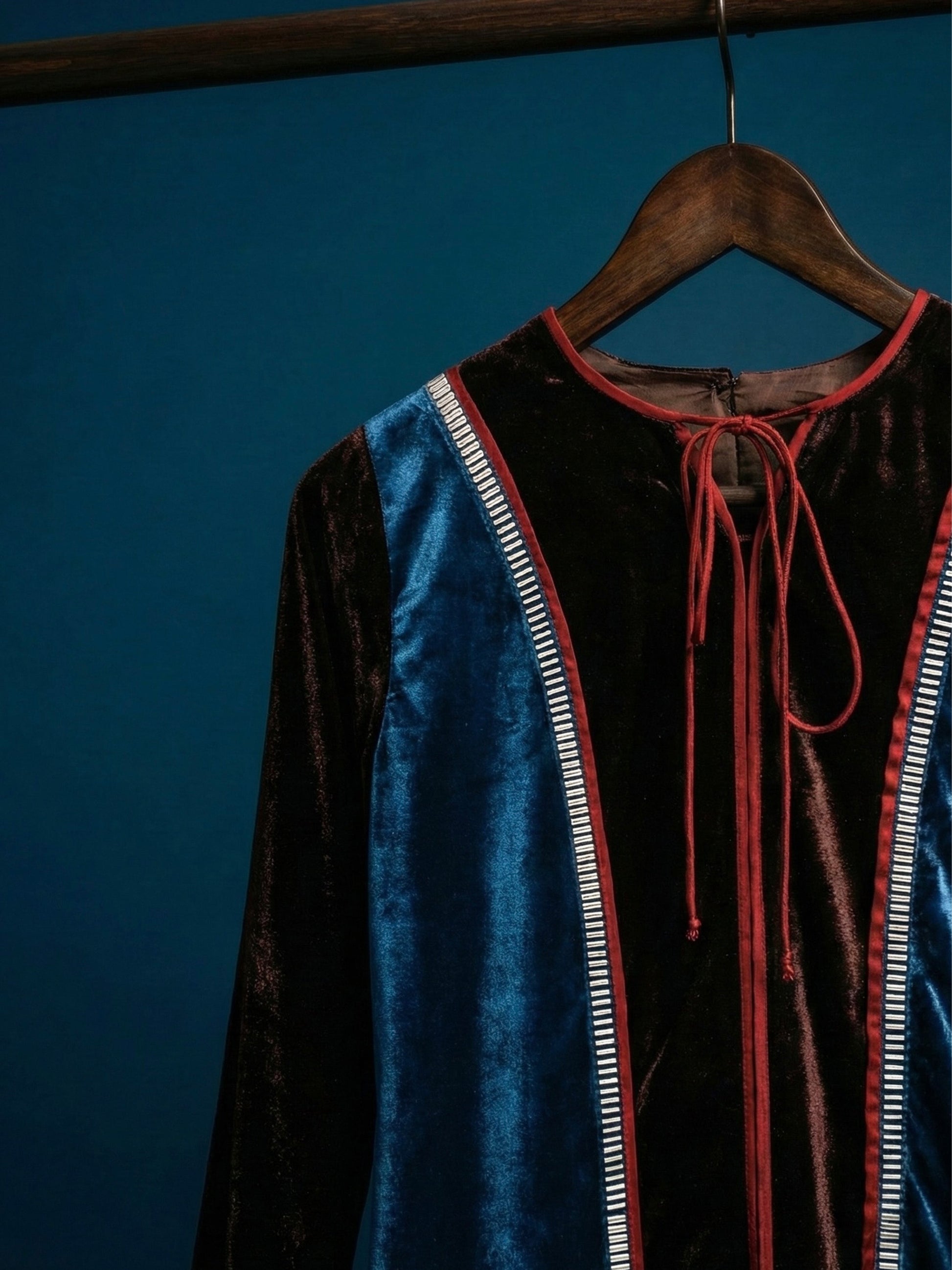 Teal and brown colorblock velvet top with red piping and 3D silver detailing by Asaaye